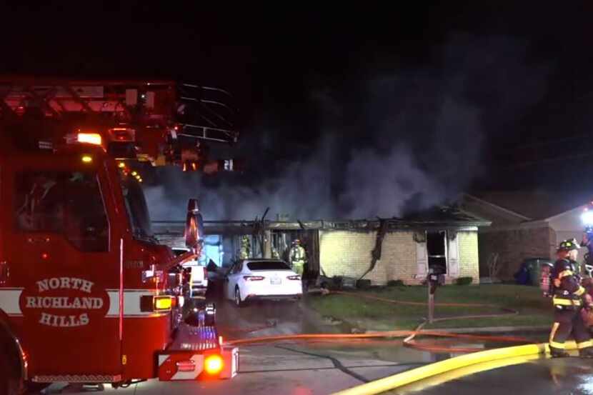 Firefighters battle a fatal blaze that broke out Thursday morning at a one-story home in...