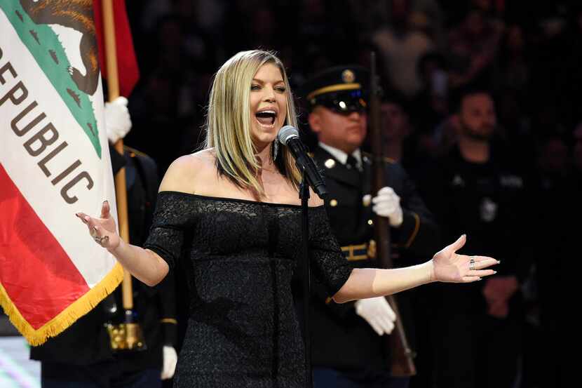 Singer Fergie performs the national anthem prior to an NBA All-Star basketball game