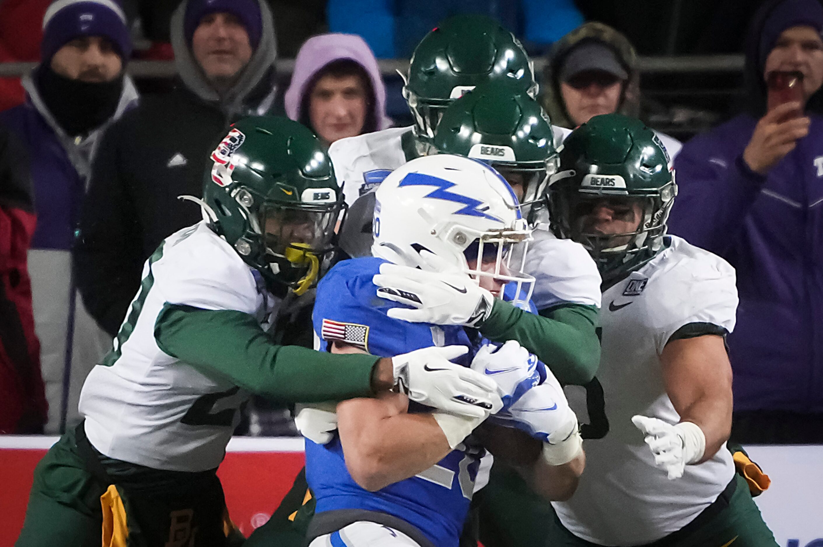 Air Force running back Brad Roberts (20) is brought down by the Baylor defense during the...