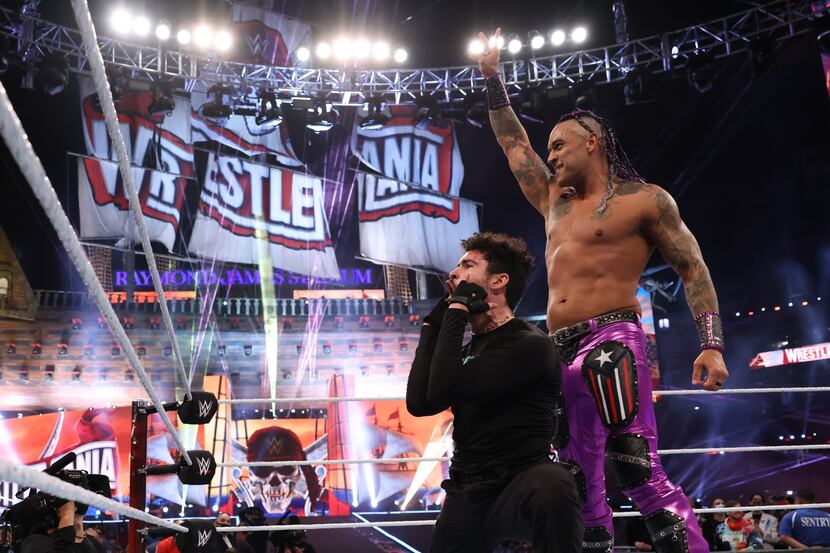 WWE's Damian Priest and rapper Bad Bunny celebrate following their win at WrestleMania 37 in...