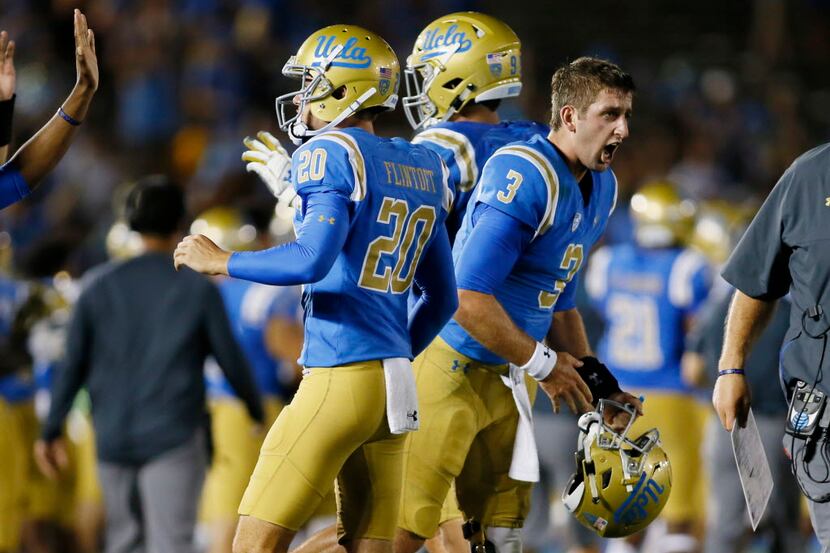 UCLA quarterback Josh Rosen celebrates after throwing for a touchdown with less than a...