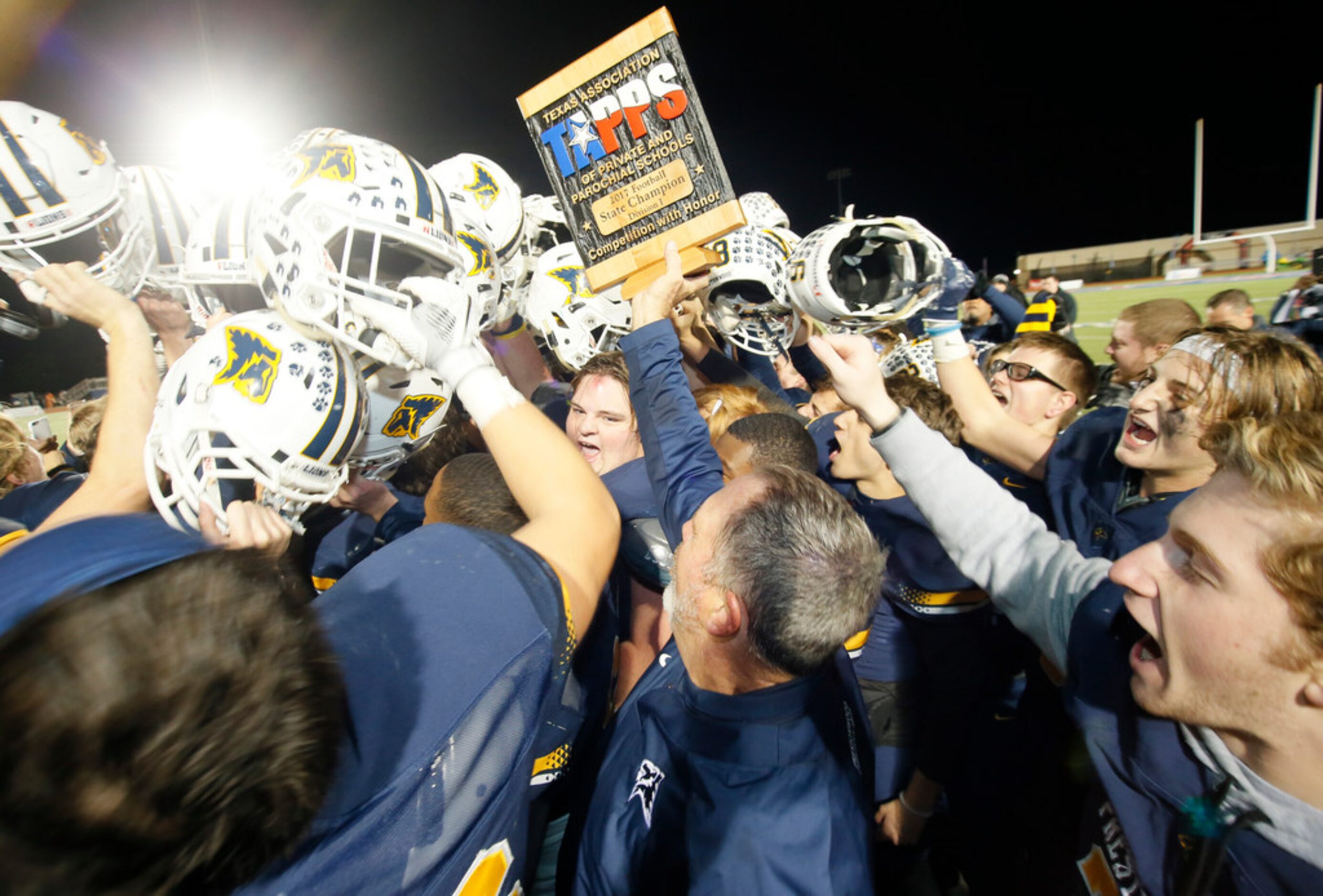 Prestonwood Christian Academy football celebrates after winning the TAPPS Division 1 11-man...