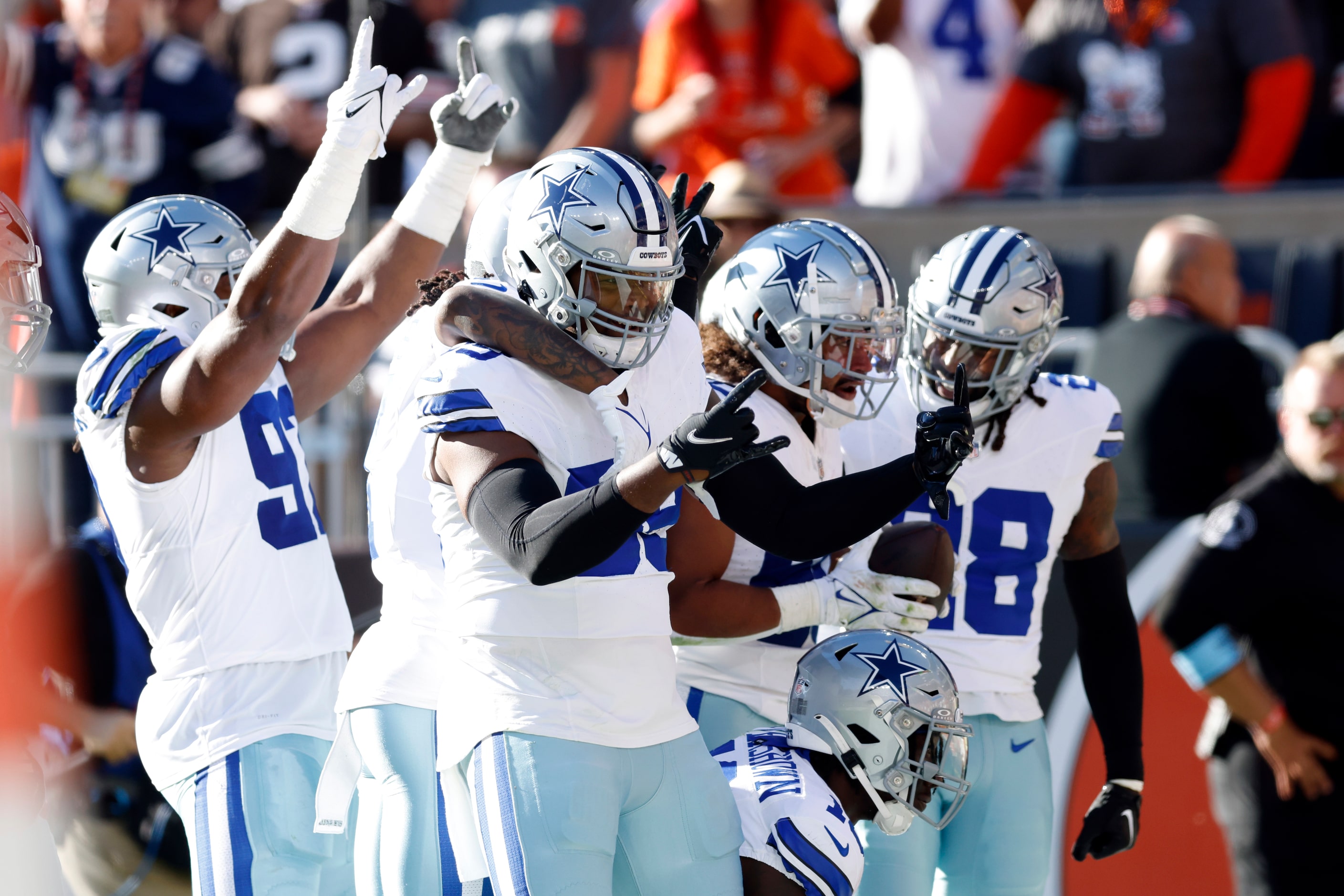 The Dallas Cowboys defense celebrates after linebacker Eric Kendricks intercepted a pass...