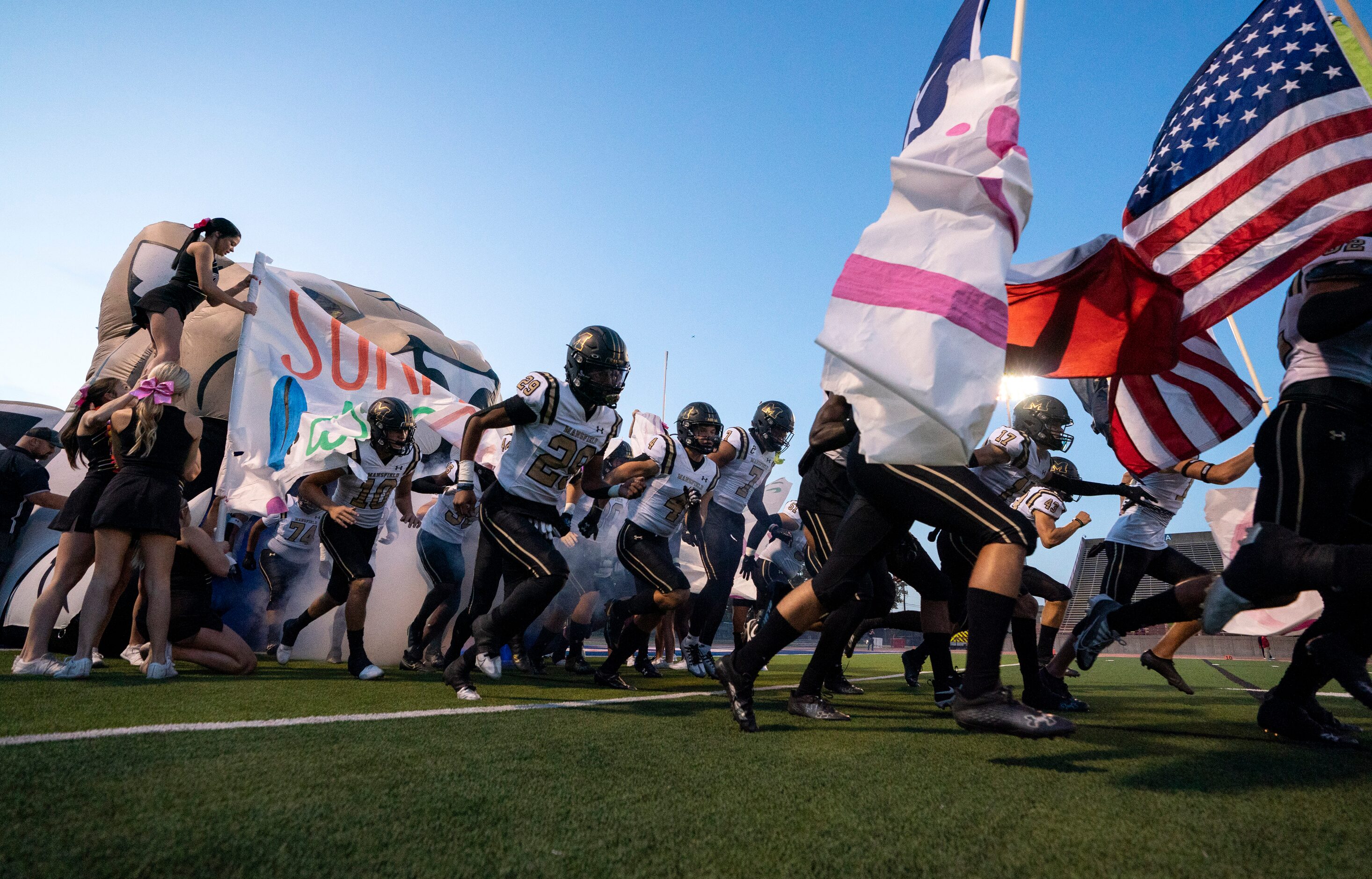 Mansfield takes the field before a high school football game against Duncanville on Friday,...