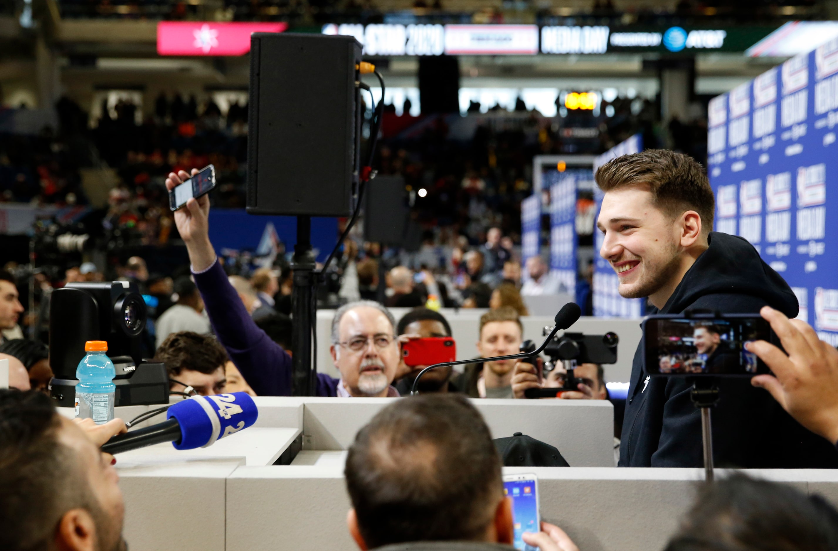 Team LeBron's Dallas Mavericks forward Luka Doncic (2) smiles as he answers questions from...