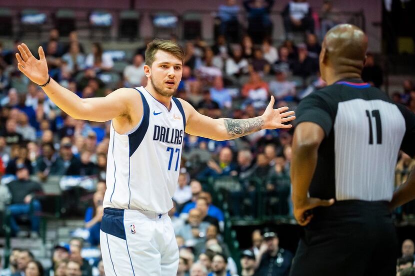 Dallas Mavericks forward Luka Doncic reacts after being called for a foul during the first...