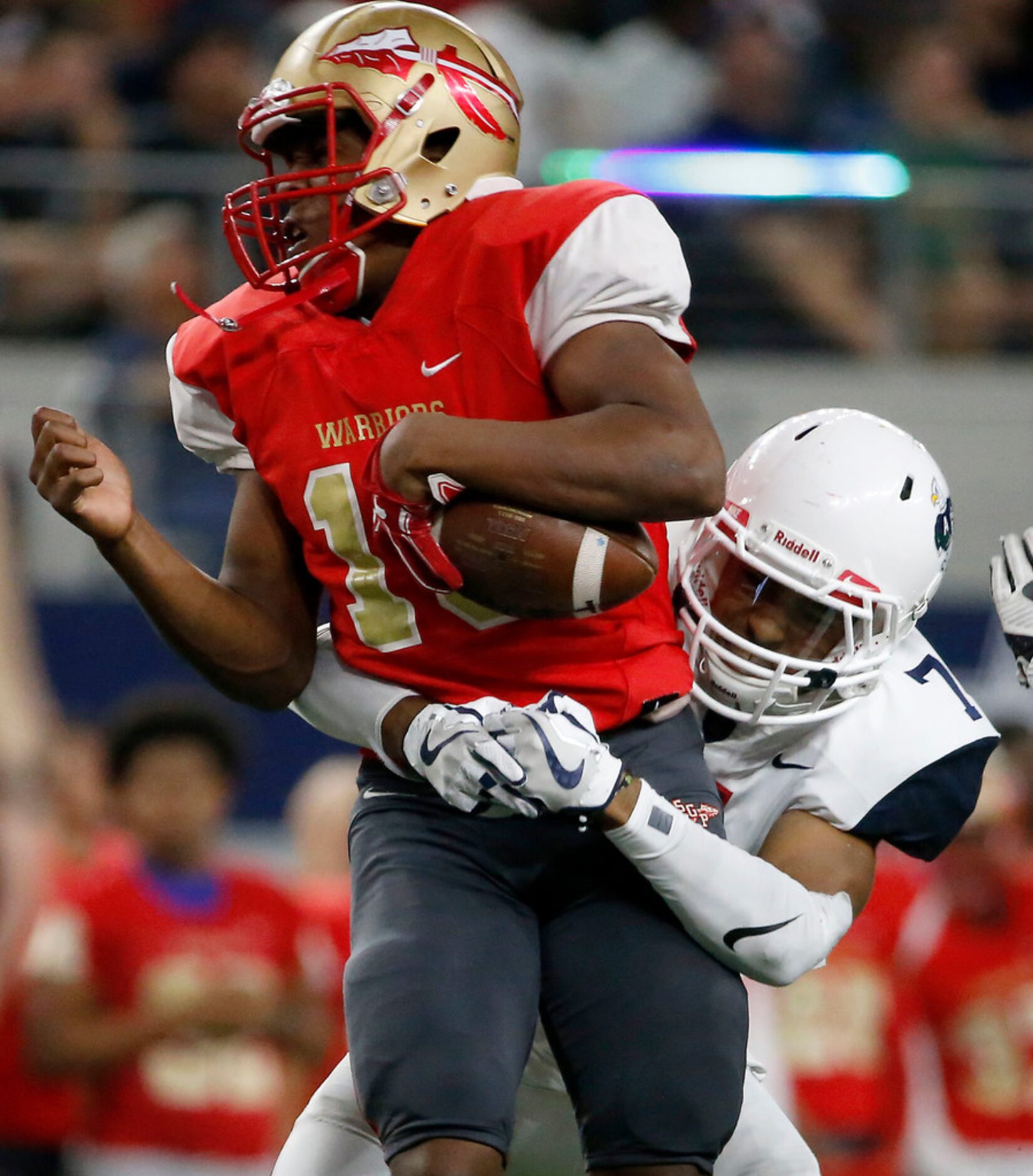 South Grand Prairie quarterback Nakia Brown (10) gets hit by Allen's CJ Johnson (7) during...