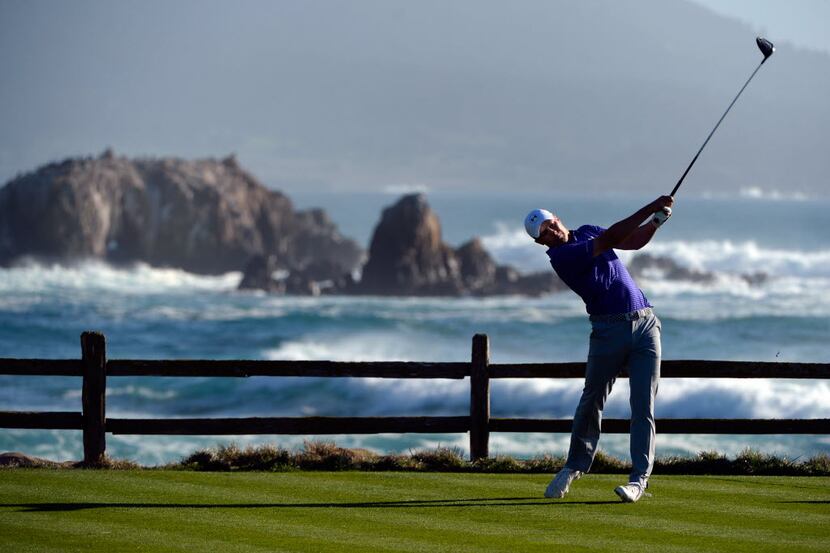 PEBBLE BEACH, CA - FEBRUARY 13:  Jordan Spieth plays his tee shot on the 18th hole during...