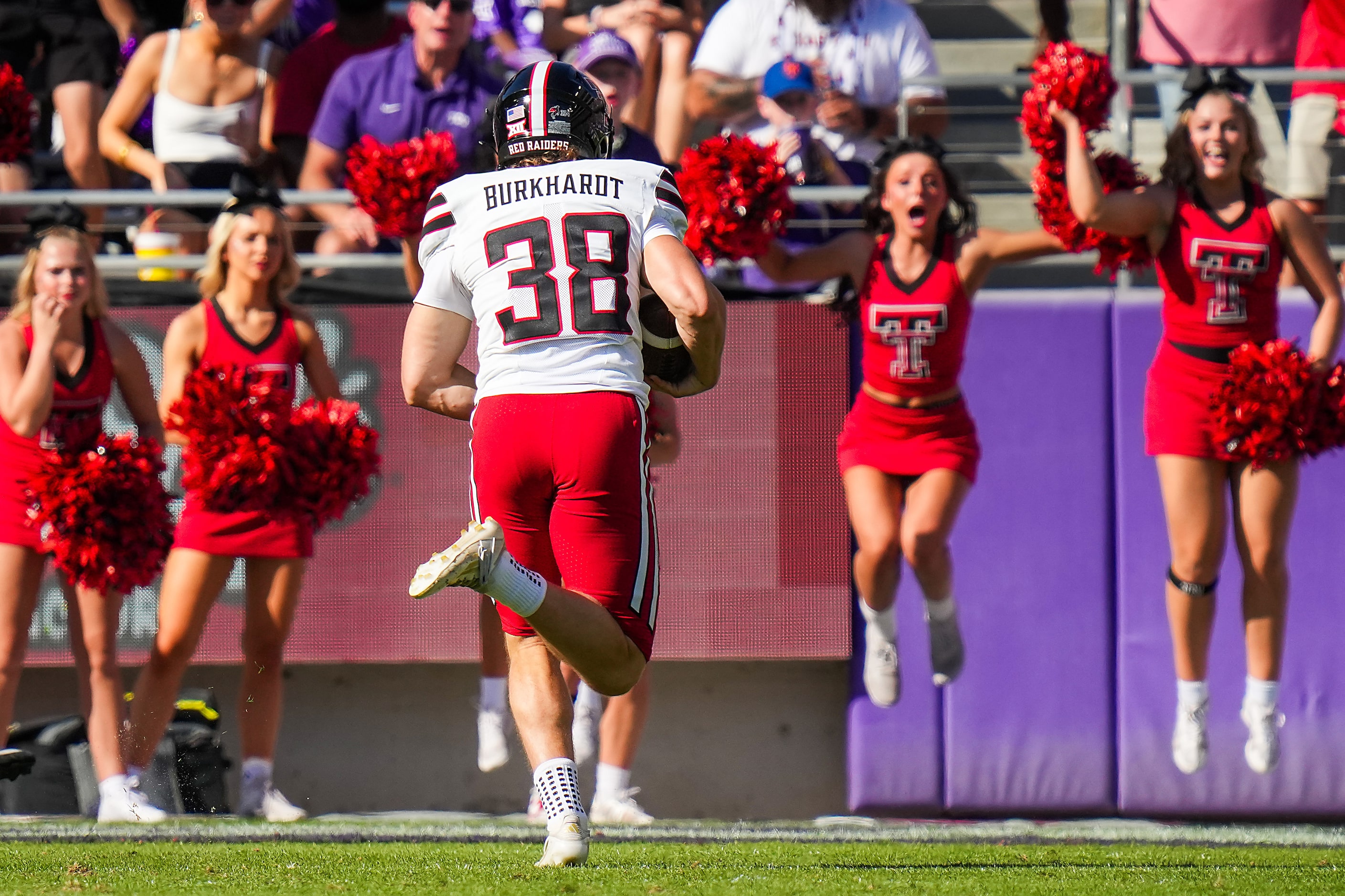 Texas Tech place kicker Reese Burkhardt (38) scores a touchdown on a fake field goal during...