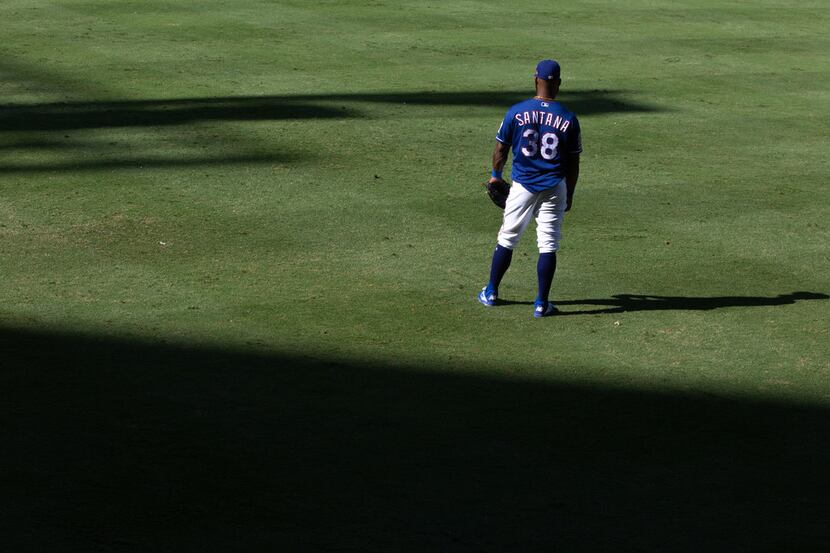 FILE - Danny Santana heads for the dugout during the Rangers' final game ever played at...