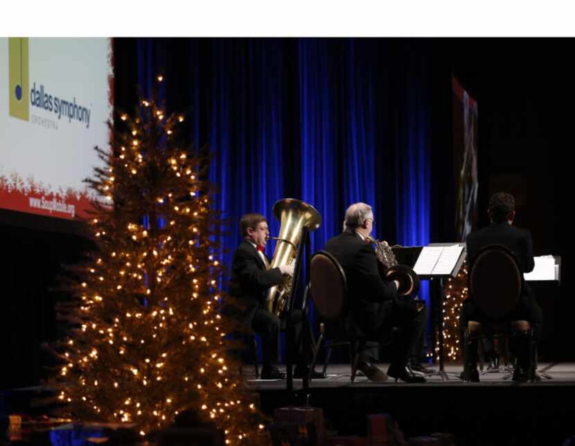 The Dallas Symphony Orchestra Brass Quintet performed at the luncheon for 500 homeless...