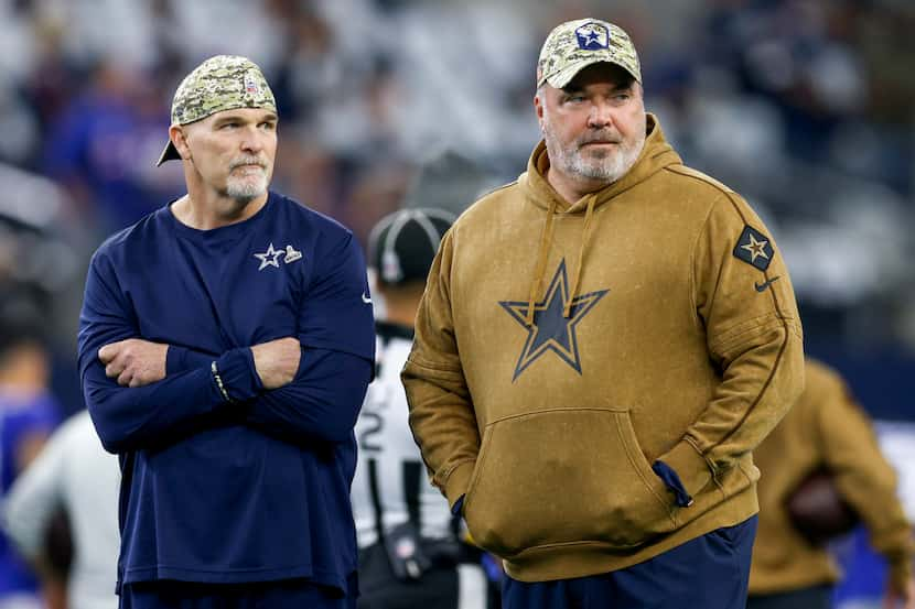 Dallas Cowboys defensive coordinator Dan Quinn (left) and head coach Mike McCarthy watch...