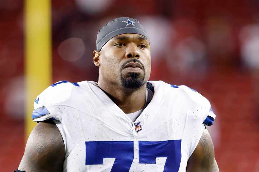 Dallas Cowboys offensive tackle Tyron Smith (77) walks off the field following their loss to...