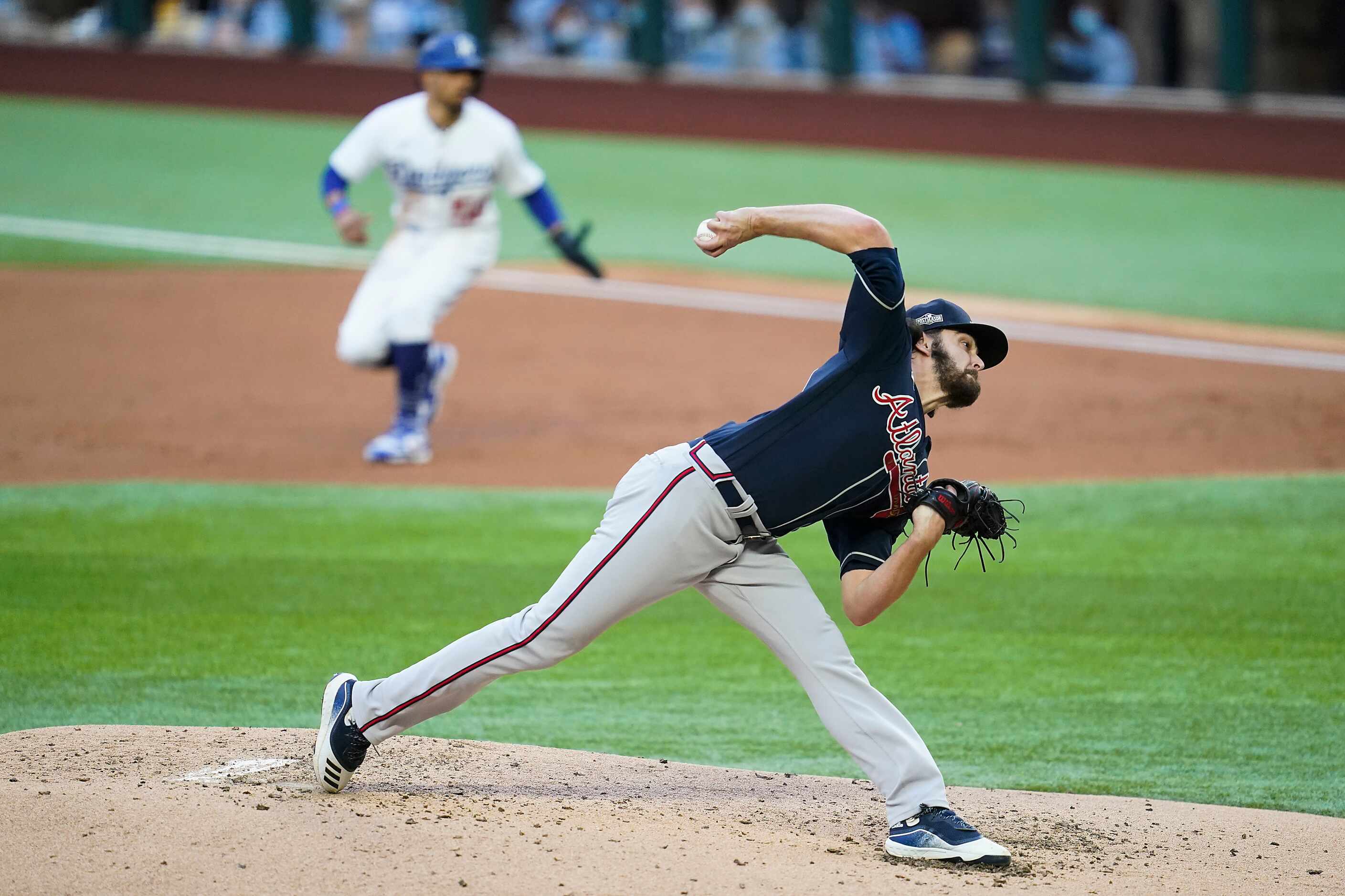 Atlanta Braves starting pitcher Ian Anderson delivers as Los Angeles Dodgers right fielder...