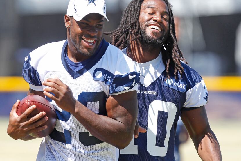 Dallas Cowboys running back DeMarco Murray (29) and defensive back Danny McCray (40) share a...