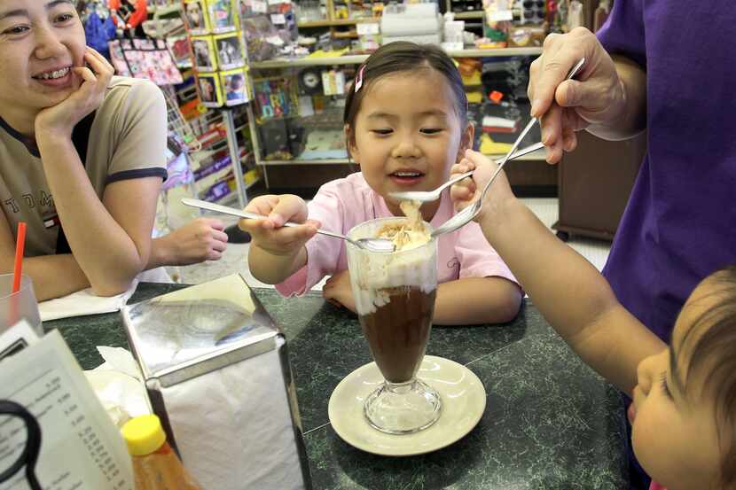 In this DMN file photo, Sophia Lau shares her ice cream treat around its 100th anniversary...