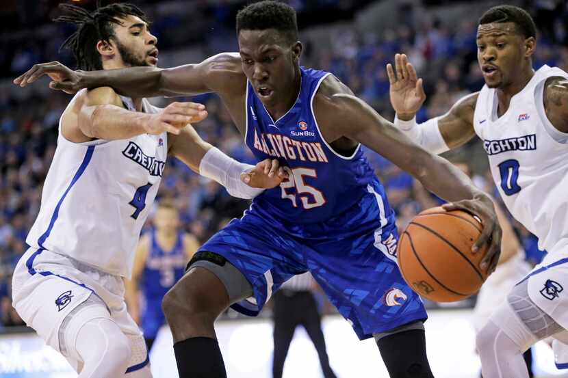 FILE - Texas-Arlington's Kevin Hervey (25) is defended by Creighton's Marcus Foster (0) and...