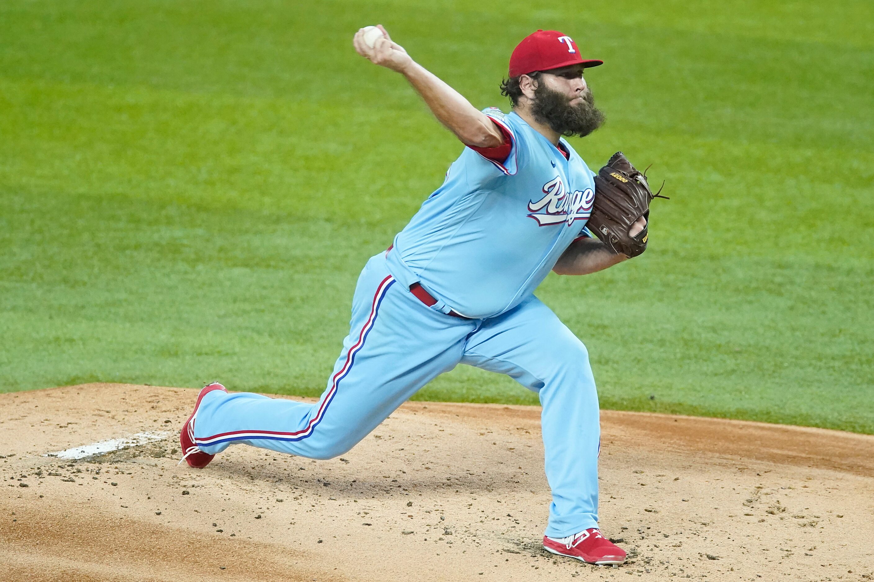 Texas Rangers starting pitcher Lance Lynn delivers during the first inning against the...