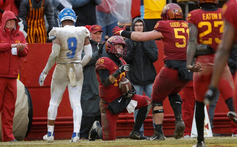 Iowa State quarterback Brock Purdy (15) celebrates with teammate Julian Good-Jones (51)...