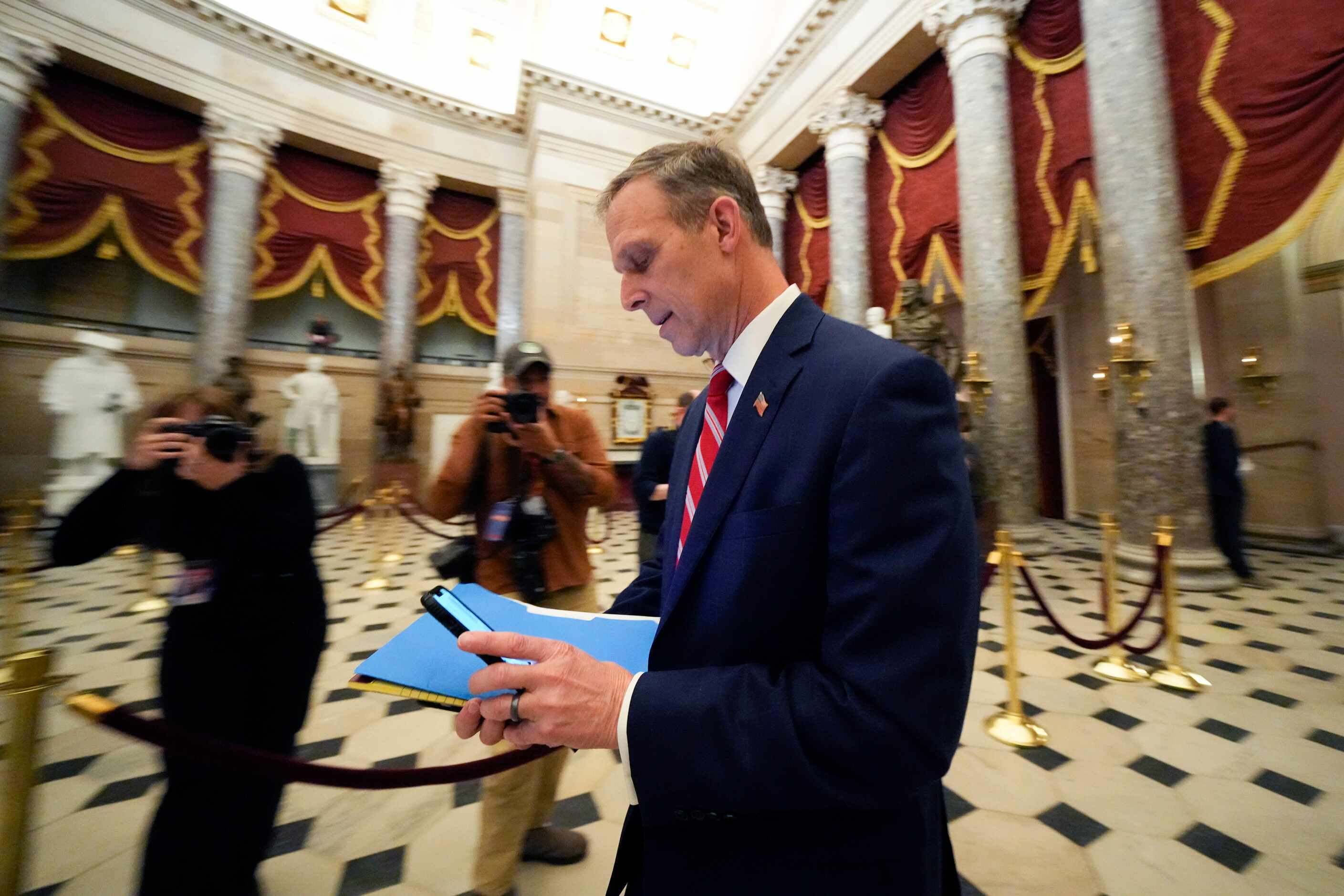 Rep. Scott Perry, R-Pa., walks through Statuary Hall as the House meets for the third day to...