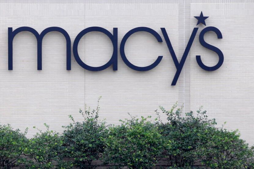 FILE - This Friday, July 10, 2015, file photo, shows signage at a Macy's department store at...