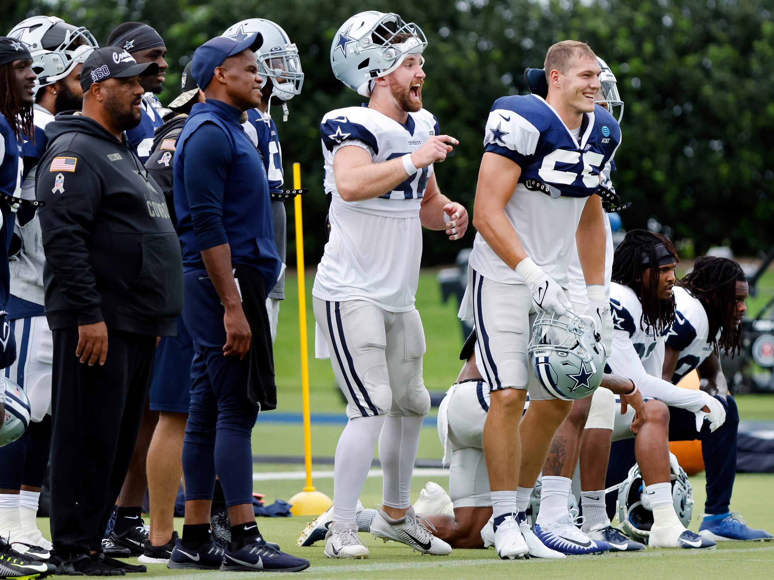 Dallas Cowboys tight end Dalton Schultz (center) reacts as special teams players race during...