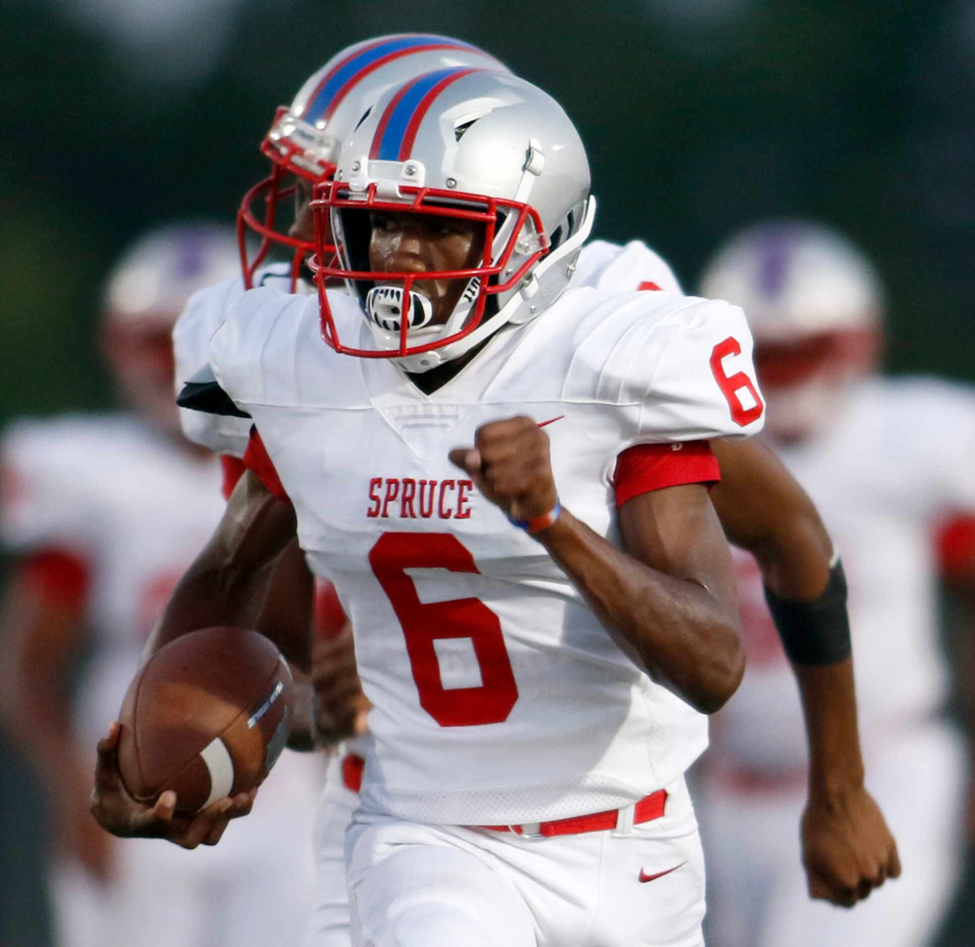 Spruce receiver Adrian Wickware (6) is "off to the races" enroute to a 64-yard touchdown...