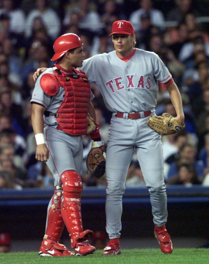 ORG XMIT:  Yankees-Rangers Division Series-- Texas  Rangers catcher Ivan Rodriguez talks...