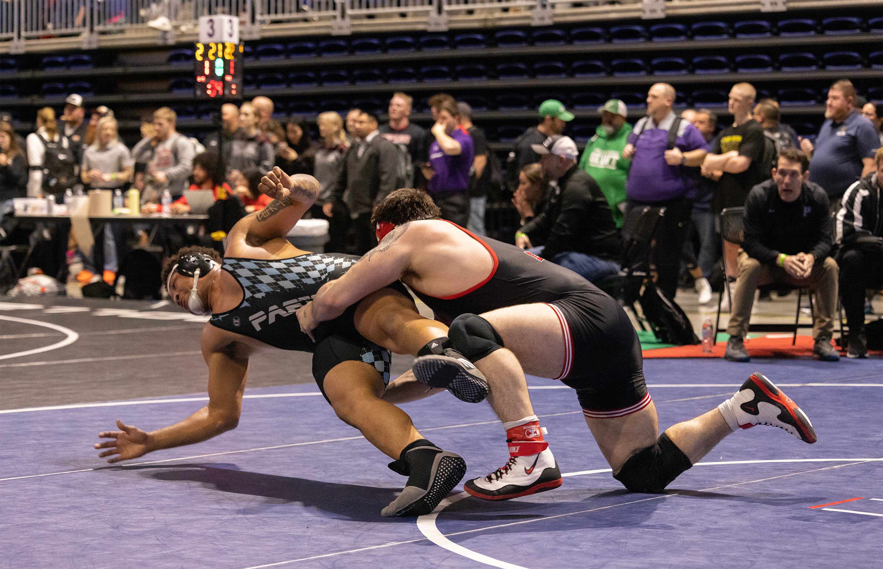 Drake Madole from Allen (right) wrestles Jarra Anderson from Katy Paetow in the 6A boys 285...