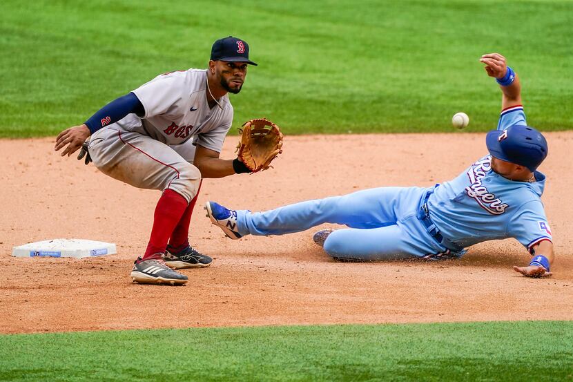 Texas Rangers first baseman Nate Lowe steals second base ahead of the throw to Boston Red...