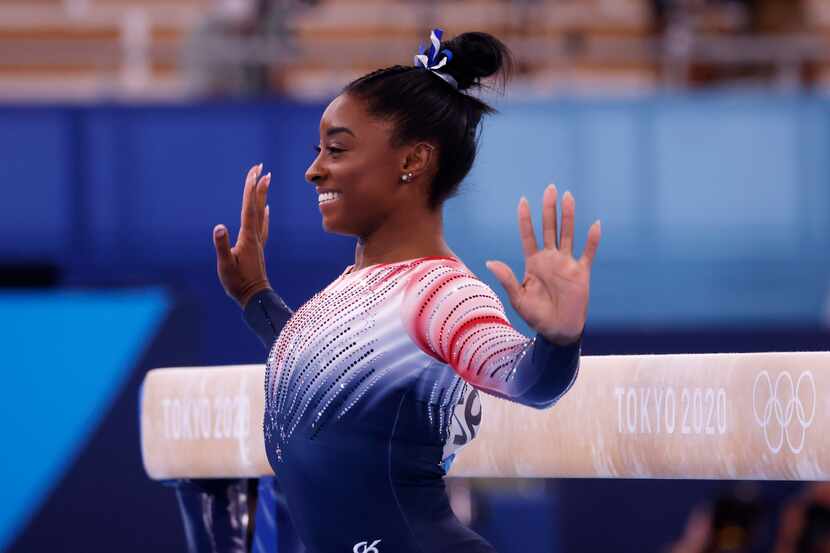 USA’s Simone Biles competes in the women’s balance beam final at the postponed 2020 Tokyo...