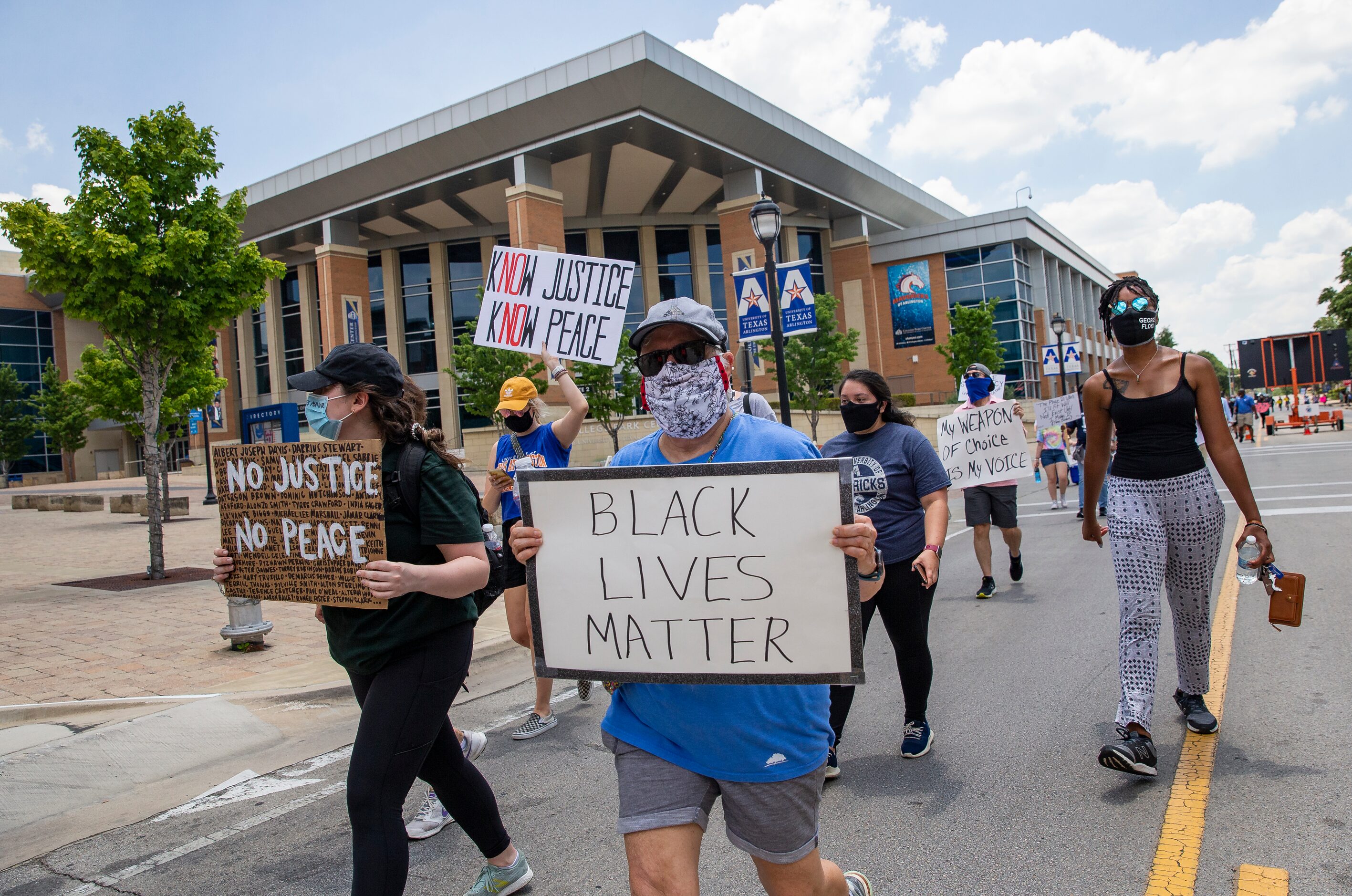 Protestors against police brutality march by College Park Center as they participate in the...