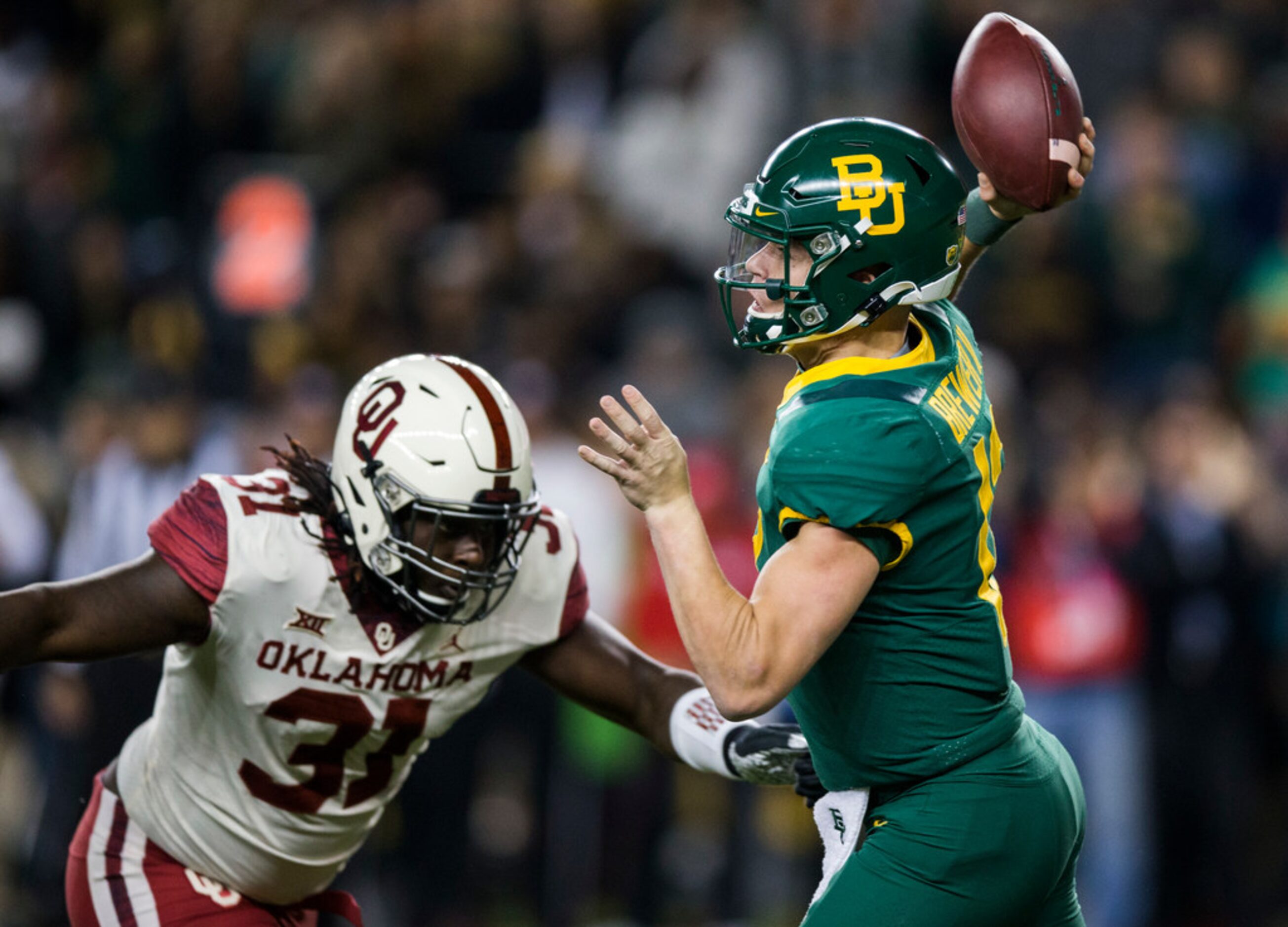 Baylor Bears quarterback Charlie Brewer (12) is threatened by Oklahoma Sooners defensive...