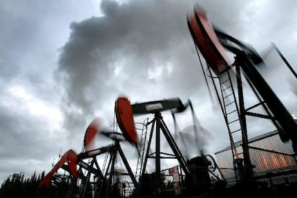 Nodding donkeys in a row -- Clusters of pump jacks at Imperial Oil Ltd.'s Cold Lake project ...