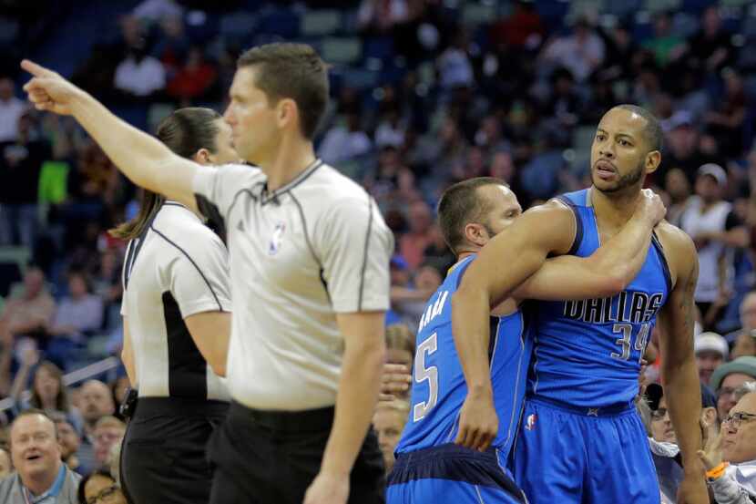 Dallas Mavericks guard Devin Harris (34) is ejected by game official Ben Taylor after...