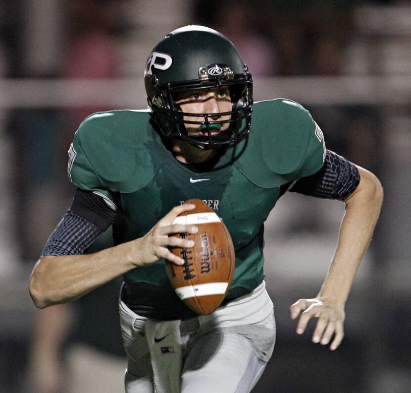 Prosper quarterback Davis Webb runs an option during the first half against Frisco Wakeland...