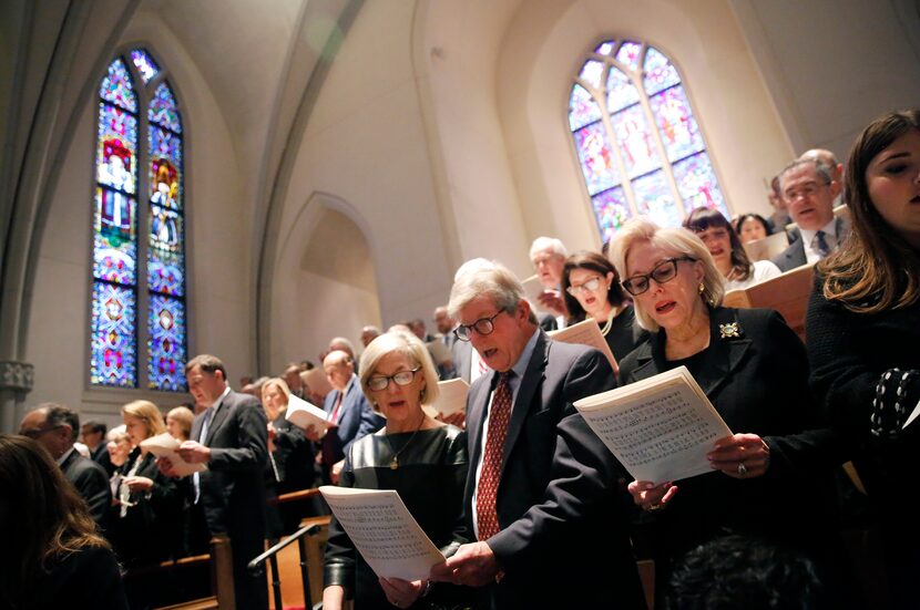 Mourners sing in the balcony during the funeral service for George H.W. Bush, the 41st...