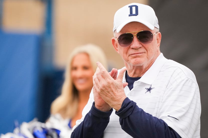 Owner and general manager Jerry Jones applauds a performance by the Dallas Cowboys...