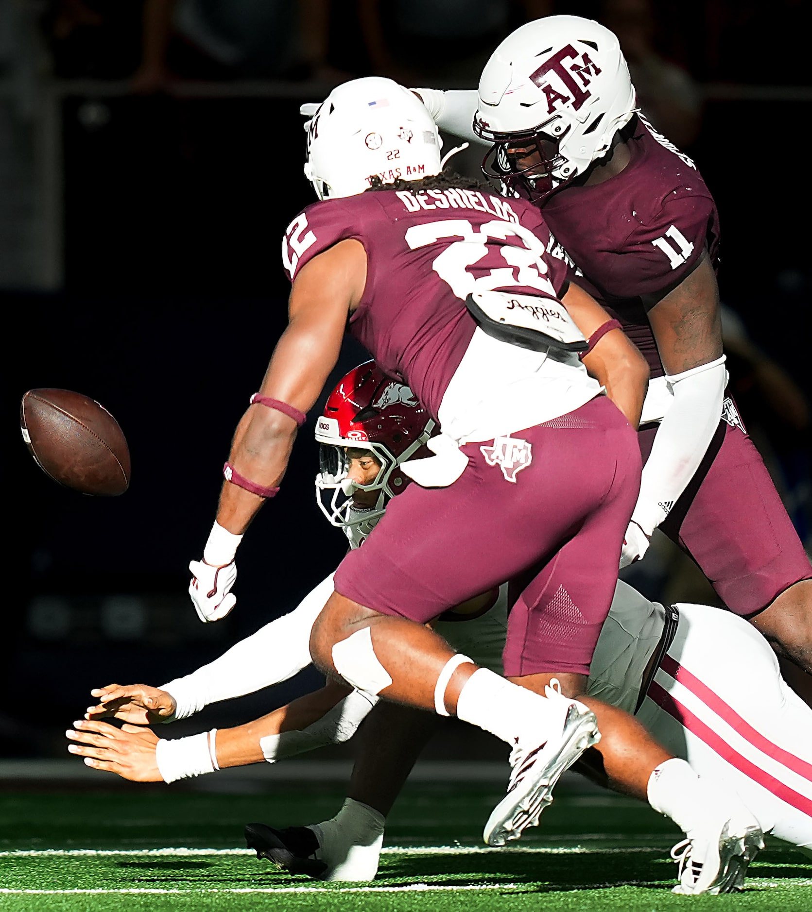 Arkansas quarterback Taylen Green (10) turns the ball over with a fumble as Texas A&M...