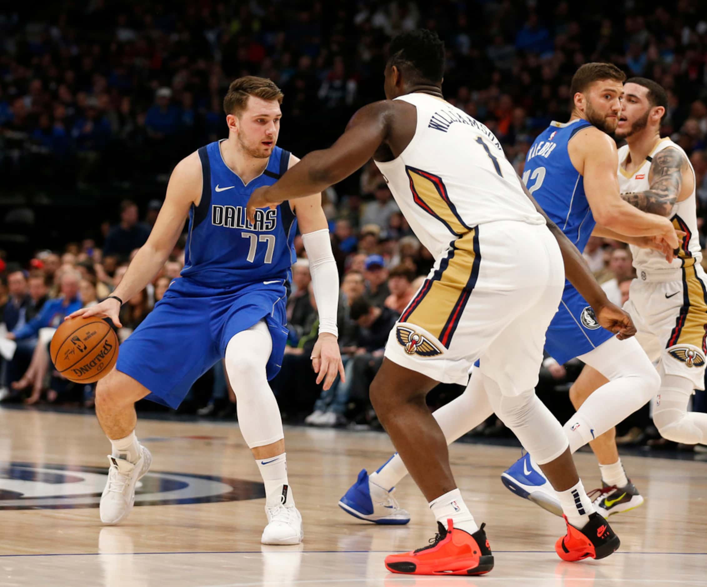 Dallas Mavericks guard Luka Doncic (77) dribbles in front of New Orleans Pelicans forward...