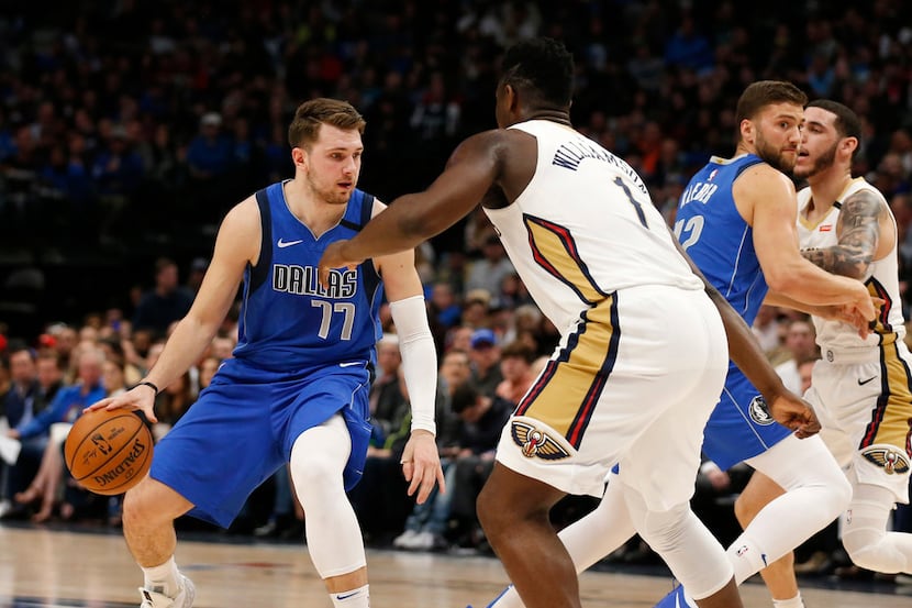 Dallas Mavericks guard Luka Doncic (77) dribbles in front of New Orleans Pelicans forward...