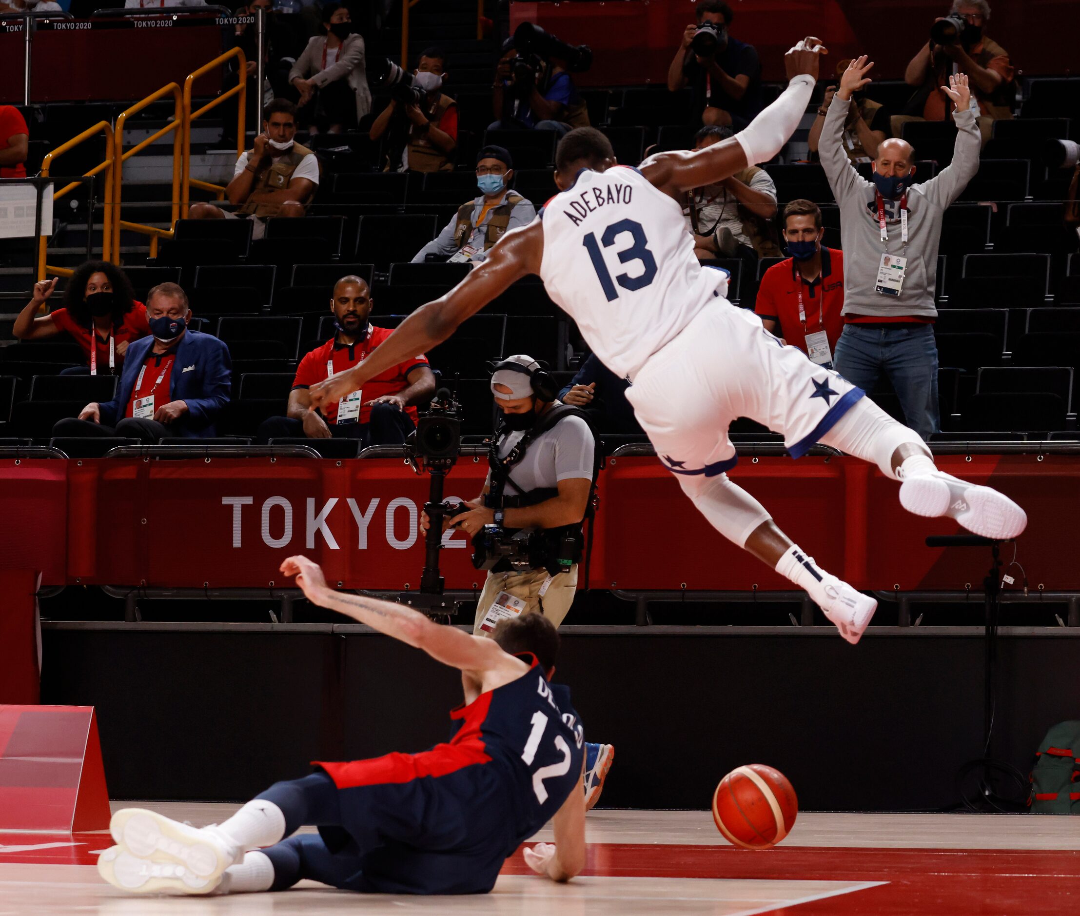 France’s Nando de Colo (12) and USA’s Bam Adebayo (13) chase down a loose ball during the...