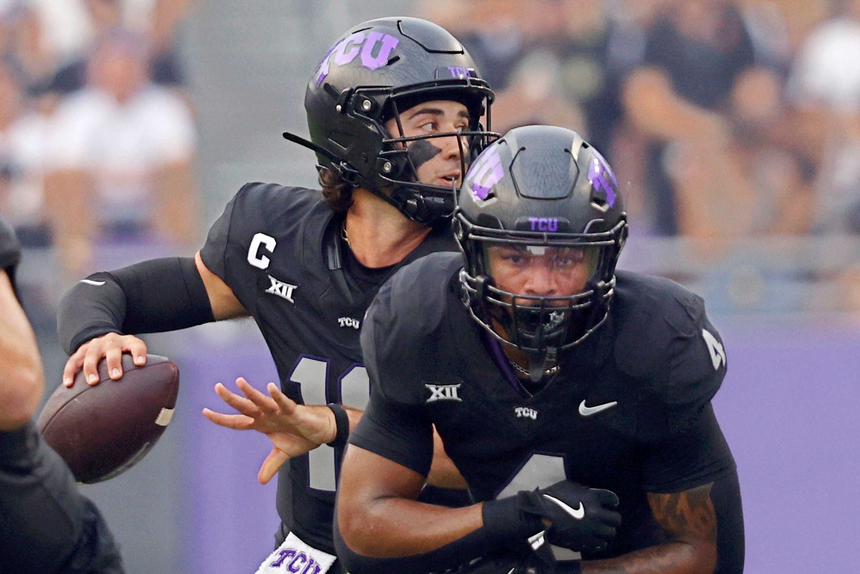 TCU quarterback Josh Hoover (10) passes against the UCF from behind his teammate running...