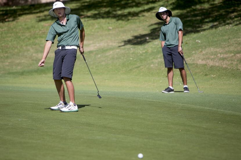 Southlake Carroll freshman Willie Hammond, left, leans into a missed putt at the UIL 5A...