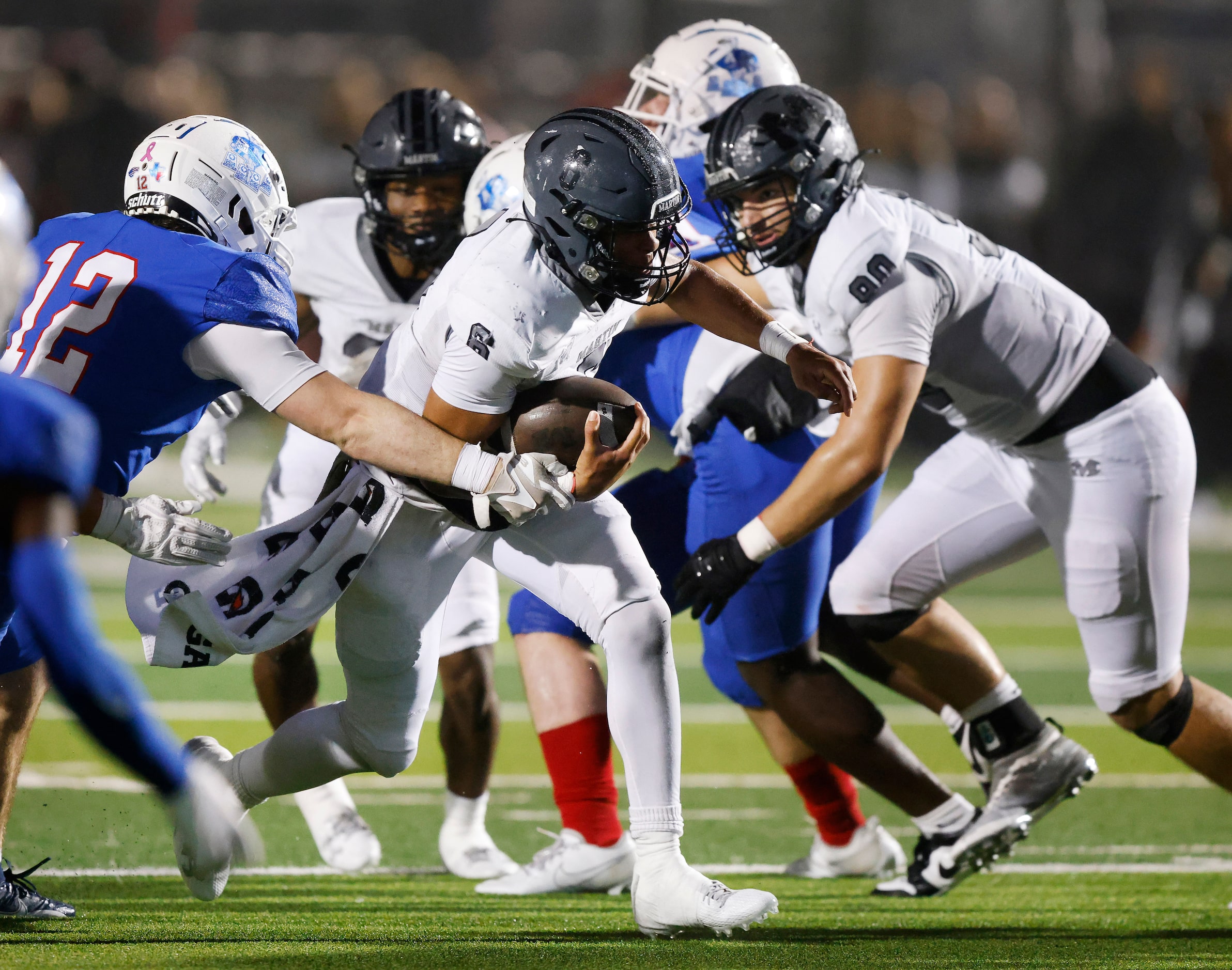 Arlington Martin running back Tristan Bittle (6) breaks through the Allen line during the...