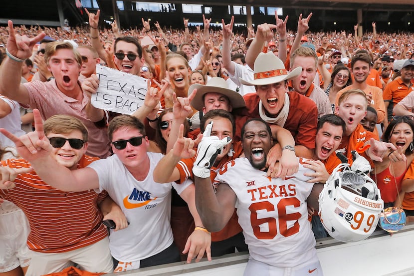 Texas Longhorns offensive lineman Calvin Anderson (66) celebrates with fans after the...