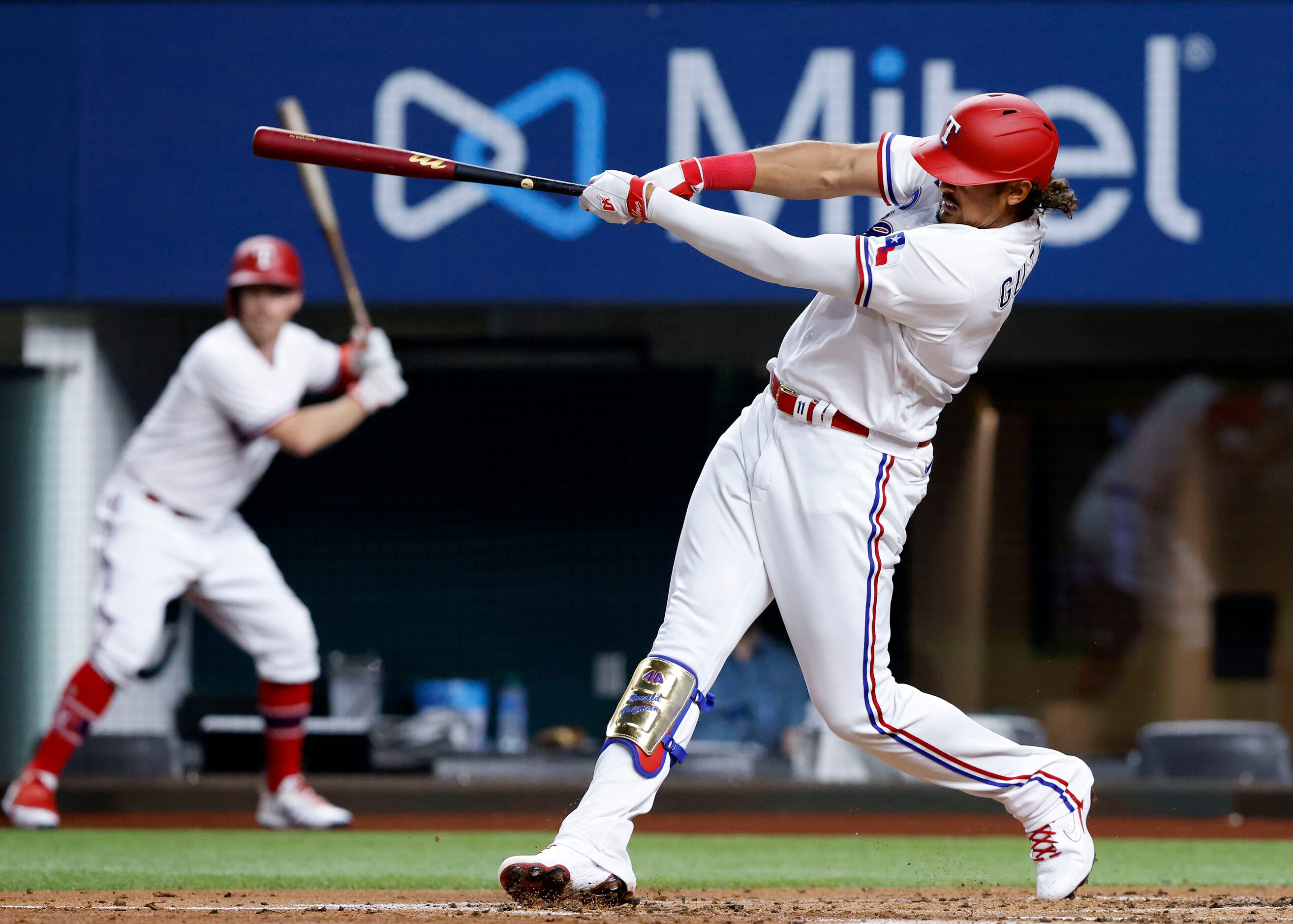 Texas Rangers Ronald Guzman connects on a solo home run during second inning against the...