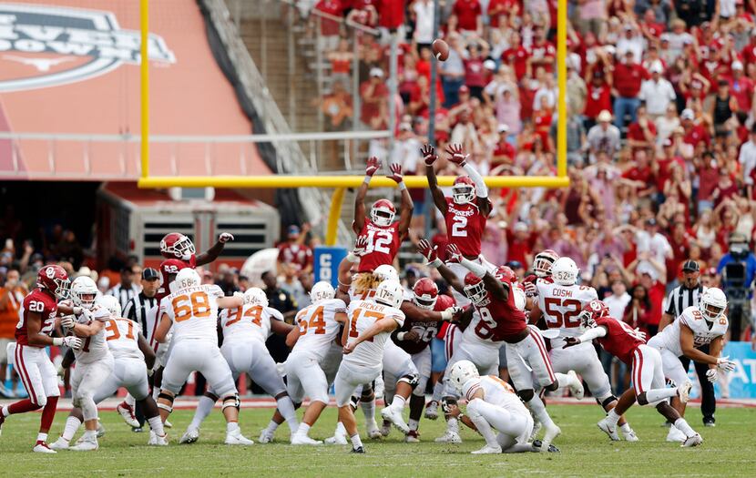 FILE - Texas Longhorns place kicker Cameron Dicker (17) kicks the game winning field goal as...