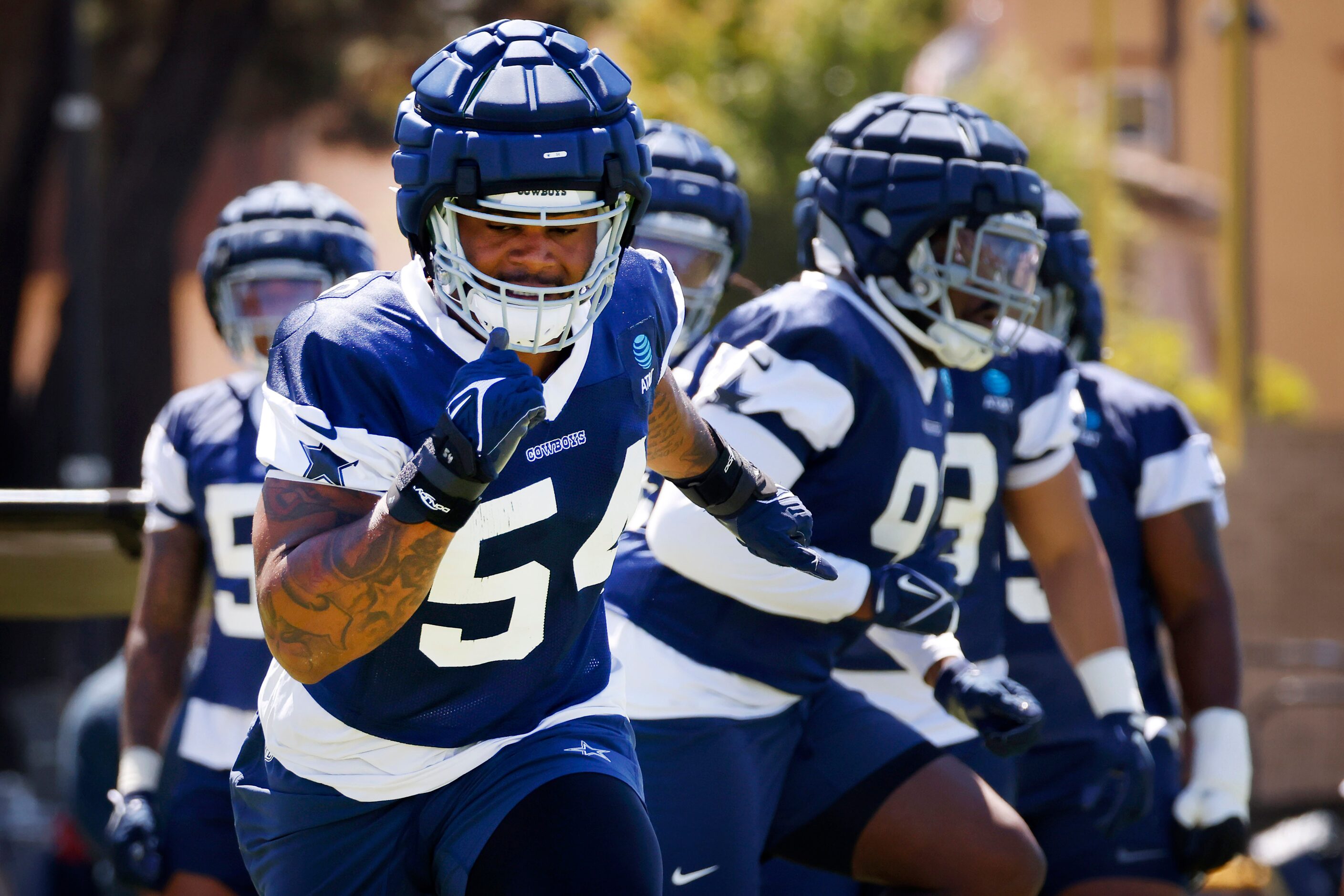 Dallas Cowboys defensive end Sam Williams (54) runs through a foot work drill during a...