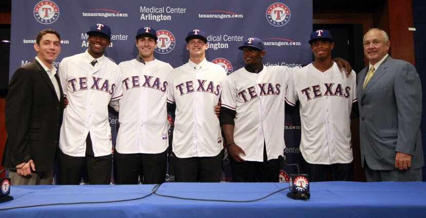 Texas Rangers General Manager Jon Daniels, left,  and president Nolan Ryan, right,  pose...